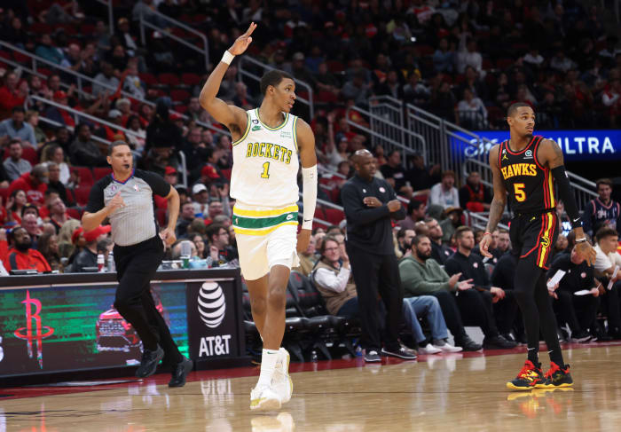 Rockets forward Jabari Smith Jr. (1) reacts to his three-point basket against Atlanta Hawks guard Dejounte Murray (5) in the third quarter at Toyota Center.